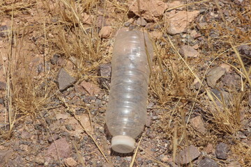 A plastic bottle lying on the ground