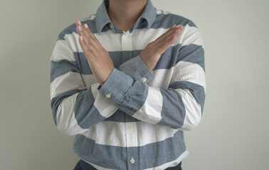 An asian unhappy and annoyed business man is suffering headache and stresses, closing his ears with...