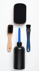 Obraz premium Cleaning Kit with Brushes Sponge and Bottle on White Background