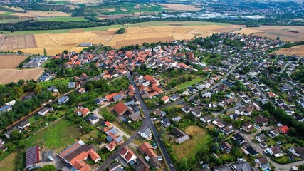 Aerial view around the old town of the city Meddersheim on a sunny spring noon