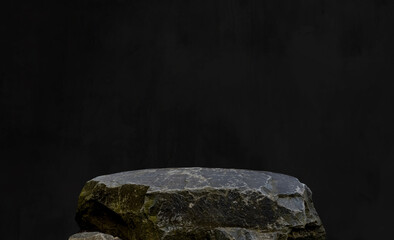 Stone Rock Podium with Black Background,Interior Studio Room Concrete Wall with light,Shadow on Rock cliff Display stage,Minimal template mockup for Jewelry Stand Product Present,Fashion branding