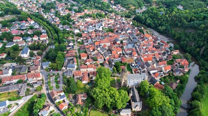 Aerial view around the old town of the city Meisenheim on a sunny spring noon