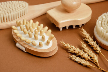 massage therapy concept, wheat and massage brushes, massagers made of natural wood and bamboo, eco friendly self-care