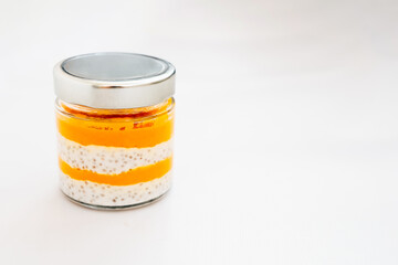 Layered dessert in a glass jar with vibrant colors and unique textures