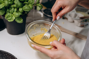 Step by step the process of cooking Italian pasta carbonara in spaghetti, add sauce with fried cubes of pancetta or bacon, eggs, cheese and garnish with basil