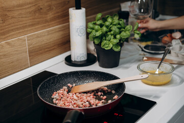 Step by step the process of cooking Italian pasta carbonara in spaghetti, add sauce with fried...