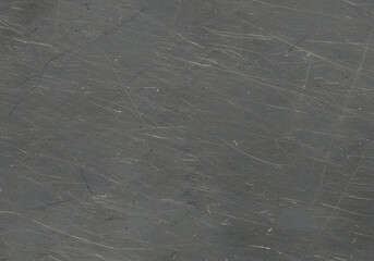 Old scratched metal texture with grunge patterns, rust stains, and worn industrial surface. Ideal for background, material design, or texture overlays