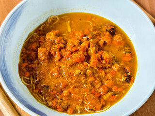 A bowl of delicious crab roe noodles