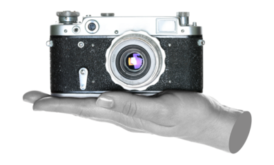 Women hand holds a retro photo camera, isolated on transparent background, front view, retro things concept. Contemporary art