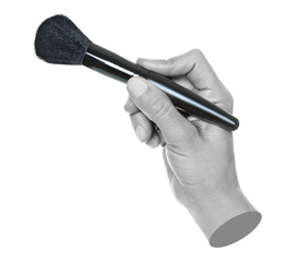 Woman hand holds black cosmetics brush, isolated on transparent background, cosmetics and visage concept. Contemporary art