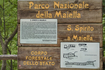  Information sign at the Monastic Complex, Abruzzo. In the town of Roccamorice, nestled in the rock, stands the interesting hermitage of Santo Spirito a Maiella, a place dear to Celestine V.