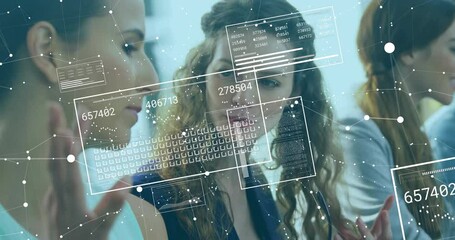 Two colleagues sitting at desk viewing data as floating numeric panels updating business analytics - Powered by Adobe