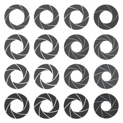 Collection of sixteen circular camera aperture icons with overlapping blades