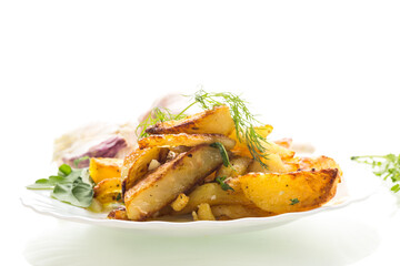 Golden potatoes with a crispy crust and spices on a white background