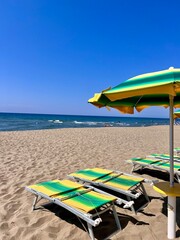 beach chairs and umbrellas