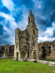 Obraz premium Warkworth Castle, Northumberland, UK with blue and cloudy sky