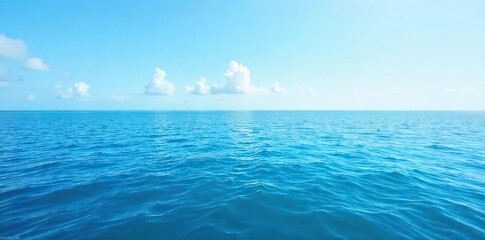 Serene Ocean Surface Vast Blue Water Under a Clear Sky, Perfect for Travel, Nature, and Environmental Projects. Ideal for Websites and Desktop Backgrounds.