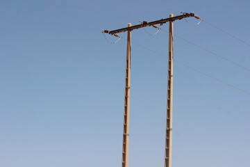 A view of an electric pole with line wire