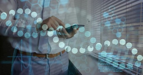 Tech pro tapping smartphone by blinds, hex overlays forming DNA strand then fading with code - Powered by Adobe