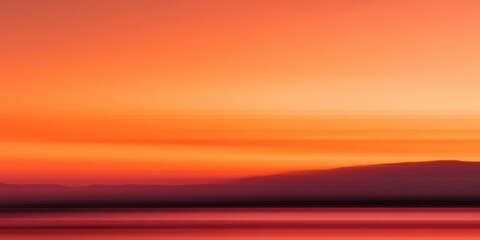 The vibrant colors of a serene sunset over the horizon.