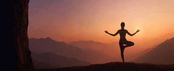 The serene silhouette of a yoga practitioner meditating at sunset over mountains.