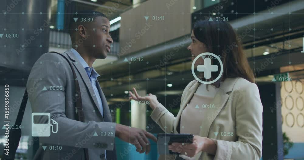 Poster man pointing at tablet and explaining business data with colleague while animated icons floating