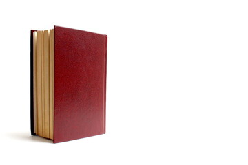 A half-open book stands on a white background.