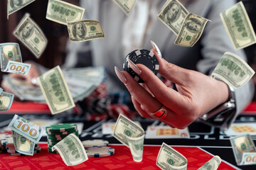 poker chips stack on table at casino, rain money fly dollar as big chance to win