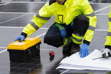 Solar panel, Solar system. Team of engineers or technicians maintaining and repairing solar power...