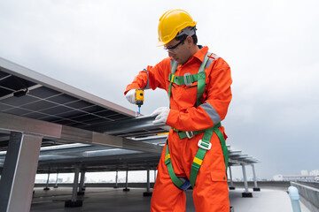 Solar panel rooftop, Rooftop solar power. Engineer or technicians maintaining and repairing solar power systems on rooftop of building. Male engineer install solar cell on rooftop