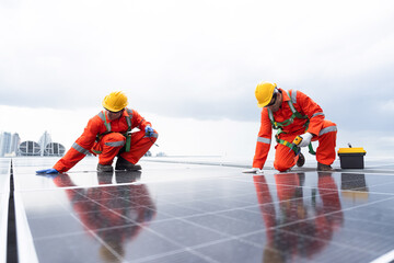 Solar panel manufacturers, Rooftop solar power, Solar rooftop. Team of engineers or technicians with safety uniform maintaining and repairing solar power systems rooftop of building
