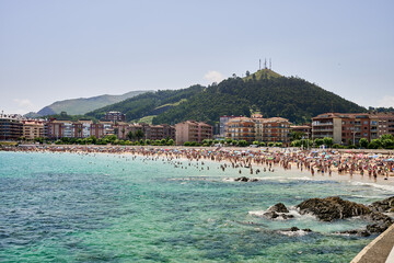Castro Urdiales, Cantabria, brazomar beach, tourists enjoying summer at brazomar beach, castro urdiales, spain