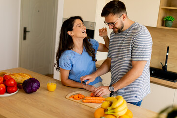 Cooking together in a bright kitchen brings joy and laughter