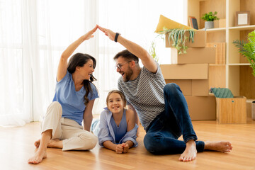 Joyful family bonding indoors creating a playful atmosphere in their cozy living room