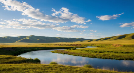 Serene grassland landscape with tranquil lake reflecting blue sky and clouds. Rolling hills and mountains in background. Nature scenery for outdoor adventure and environmental concept