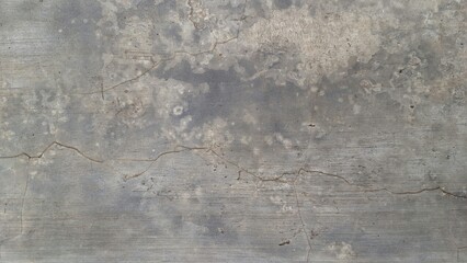 Grunge cement wall texture with weathered surface and distressed stone background, perfect for...