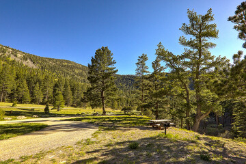 Traveling through the Sangre de Cristo Mountains between Las Vegas and Taos, New Mexico, flowing rivers, snow capped mountains, pine trees, beautiful scenery.