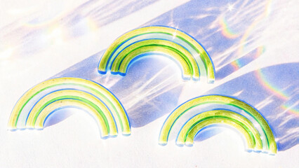 Translucent Rainbow Arches with Green and Blue Hues for Playful and Colorful Decorative Elements