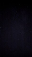 Starry night sky with faint constellations on dark background