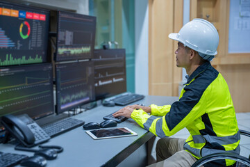 Engineer working at control room, Manager control system, Technician man monitoring program from a...