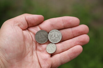 Rupee coins of India in hand
