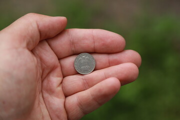 Indian coin quarter rupee in hand