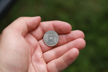 Commemorative quarter coin in hand