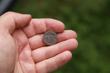 Coin of Great Britain in hand