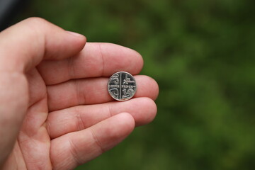 Coin of Great Britain in hand