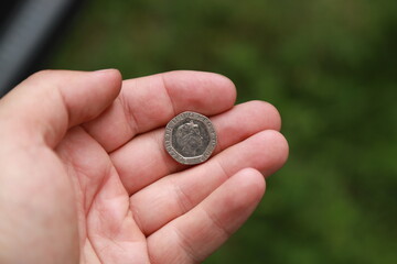 Coin of Great Britain in hand