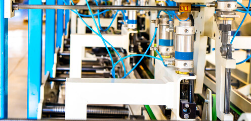 The line of assembly of cardboard packaging in boxes and finished products. Mechanism and...