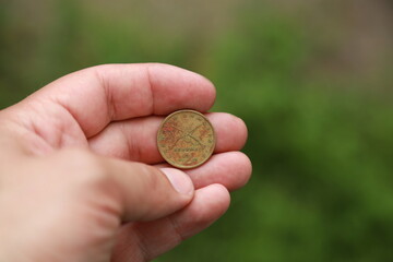 Greek change coin in hand
