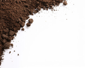 Roasted brown coffee beans on a white background with isolated instant coffee powder forming a heap