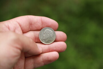 Greek change coin in hand